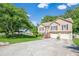 Charming two-story home features a two-car garage, manicured lawn, and inviting entryway at 435 Flowering Trl, Grayson, GA 30017