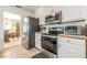 Well-equipped kitchen with stainless steel appliances and ample cabinet space, adjoining dining area at 435 Flowering Trl, Grayson, GA 30017