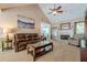 Cozy living room with a fireplace, vaulted ceiling, and comfortable seating arrangement at 435 Flowering Trl, Grayson, GA 30017