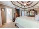 Comfortable main bedroom with tray ceilings, ensuite bathroom, and classic furniture at 435 Flowering Trl, Grayson, GA 30017