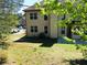 Exterior of home featuring many windows and outdoor patio at 533 Mount Gerizim Se Rd, Mableton, GA 30126
