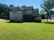 Home with large backyard featuring mature trees and a patio for outdoor entertaining at 533 Mount Gerizim Se Rd, Mableton, GA 30126