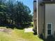 Home's backyard features a patio and mature trees at 533 Mount Gerizim Se Rd, Mableton, GA 30126