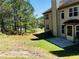 View of the house and backyard showing a patio and treeline at 533 Mount Gerizim Se Rd, Mableton, GA 30126