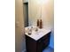 Bathroom featuring a white sink and vanity, large mirror, and neutral wall paint at 533 Mount Gerizim Se Rd, Mableton, GA 30126
