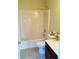 Bright bathroom with a white tub/shower, toilet, and vanity featuring a tile floor at 533 Mount Gerizim Se Rd, Mableton, GA 30126