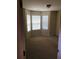 Bedroom featuring large windows, neutral carpeting and a ceiling fan at 533 Mount Gerizim Se Rd, Mableton, GA 30126
