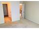 Bedroom with neutral carpet, cream walls and white trim with doors open to hallway and upper floor at 533 Mount Gerizim Se Rd, Mableton, GA 30126