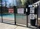 Gated community pool with posted hours and capacity for residents' enjoyment at 533 Mount Gerizim Se Rd, Mableton, GA 30126