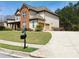 Attractive home featuring a long driveway, attached garage, and a neatly kept lawn at 533 Mount Gerizim Se Rd, Mableton, GA 30126