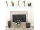 Close up of the fireplace with mantel decorations and flower arrangement at 533 Mount Gerizim Se Rd, Mableton, GA 30126