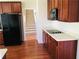 Well-lit kitchen features stainless steel appliances, smooth countertop, and hardwood floors at 533 Mount Gerizim Se Rd, Mableton, GA 30126
