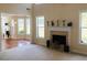 Light filled living room features fireplace, mantel decorations, and multiple windows at 533 Mount Gerizim Se Rd, Mableton, GA 30126