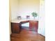 Office featuring a built-in desk with cabinets and drawers, hardwood floors, and natural light at 533 Mount Gerizim Se Rd, Mableton, GA 30126