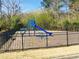 Neighborhood playground with blue slide, benches, and black metal fence at 533 Mount Gerizim Se Rd, Mableton, GA 30126
