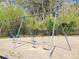 Neighborhood swing set with wood chip base and tall trees in the background at 533 Mount Gerizim Se Rd, Mableton, GA 30126
