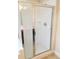 Modern glass-enclosed shower with chrome hardware and neutral tile at 533 Mount Gerizim Se Rd, Mableton, GA 30126