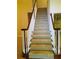 Carpeted staircase with white spindles and dark wood banister at 533 Mount Gerizim Se Rd, Mableton, GA 30126