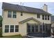 Backyard view featuring a large two-story home with lots of windows and a trampoline at 5578 Swanson Rd, Ellenwood, GA 30294