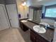 Bright bathroom boasts double sinks, a large mirror, and a shower-tub combo at 5578 Swanson Rd, Ellenwood, GA 30294