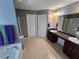 A bright bathroom featuring double sinks, a separate shower, and a relaxing soaking tub at 5578 Swanson Rd, Ellenwood, GA 30294