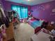 A playful ' bedroom with themed decor, toys, and lots of natural light at 5578 Swanson Rd, Ellenwood, GA 30294