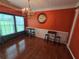 Traditional dining room featuring elegant lighting and hardwood flooring at 5578 Swanson Rd, Ellenwood, GA 30294