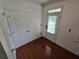 Foyer with hardwood flooring, closet, and door to the backyard at 5578 Swanson Rd, Ellenwood, GA 30294
