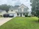 Charming two-story home with a well-maintained lawn, attached garage, and classic curb appeal at 5578 Swanson Rd, Ellenwood, GA 30294