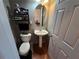 Cozy half bathroom with pedestal sink and decorative accents at 5578 Swanson Rd, Ellenwood, GA 30294