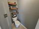 A tidy powder room featuring modern fixtures, tasteful decor, and space-saving shelving at 5578 Swanson Rd, Ellenwood, GA 30294