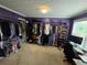 Spacious walk-in closet with ample hanging space, shelving, and a workstation with natural light at 5578 Swanson Rd, Ellenwood, GA 30294