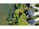Aerial view of house with shoreline, trees, and dock at 6310 Stillwood Ln, Cumming, GA 30041