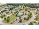 Aerial view of neighborhood with pool, playground, landscaping, and homes at 6310 Stillwood Ln, Cumming, GA 30041