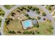 Aerial view of community pool, playground, and parking area at 6310 Stillwood Ln, Cumming, GA 30041