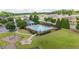 Aerial view of pool with playground and pergola seating at 6310 Stillwood Ln, Cumming, GA 30041