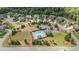Aerial view of community with pool, playground, and lush landscaping at 6310 Stillwood Ln, Cumming, GA 30041