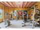 Spacious basement area with gym equipment, ready for a complete workout space at 6310 Stillwood Ln, Cumming, GA 30041