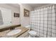 Bathroom with tiled floors, a granite-topped vanity, toilet and shower featuring a shower curtain at 6310 Stillwood Ln, Cumming, GA 30041