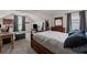 Bedroom offering angled ceilings, a window, soft carpeting, a wooden dresser and a queen size bed at 6310 Stillwood Ln, Cumming, GA 30041