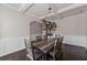 A well-lit dining room showing decorative lighting above the wooden table at 6310 Stillwood Ln, Cumming, GA 30041