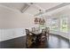 Dining room with coffered ceilings, chandelier, and a large window at 6310 Stillwood Ln, Cumming, GA 30041