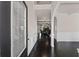 View of the long foyer featuring a hardwood floor leading to the living area at 6310 Stillwood Ln, Cumming, GA 30041