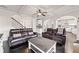 Spacious living room with dark hardwood floors, coffered ceilings, and an open layout at 6310 Stillwood Ln, Cumming, GA 30041