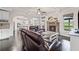 Open living room with fireplace, hardwood floors, and view to the kitchen at 6310 Stillwood Ln, Cumming, GA 30041