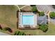 Aerial view of community pool with lounge chairs and landscaping at 6310 Stillwood Ln, Cumming, GA 30041