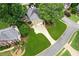 Bird's eye view showcases a home with lush lawn, long driveway, and landscaped grounds at 750 Highview Ct, Woodstock, GA 30189