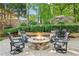 Inviting backyard with stone fire pit and comfortable seating for outdoor gatherings at 750 Highview Ct, Woodstock, GA 30189