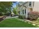 A sprawling backyard is complete with a stone patio, a grill and a fire pit at 750 Highview Ct, Woodstock, GA 30189