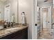Well-maintained bathroom with a granite vanity, tile flooring, and a shower with a curtain at 750 Highview Ct, Woodstock, GA 30189
